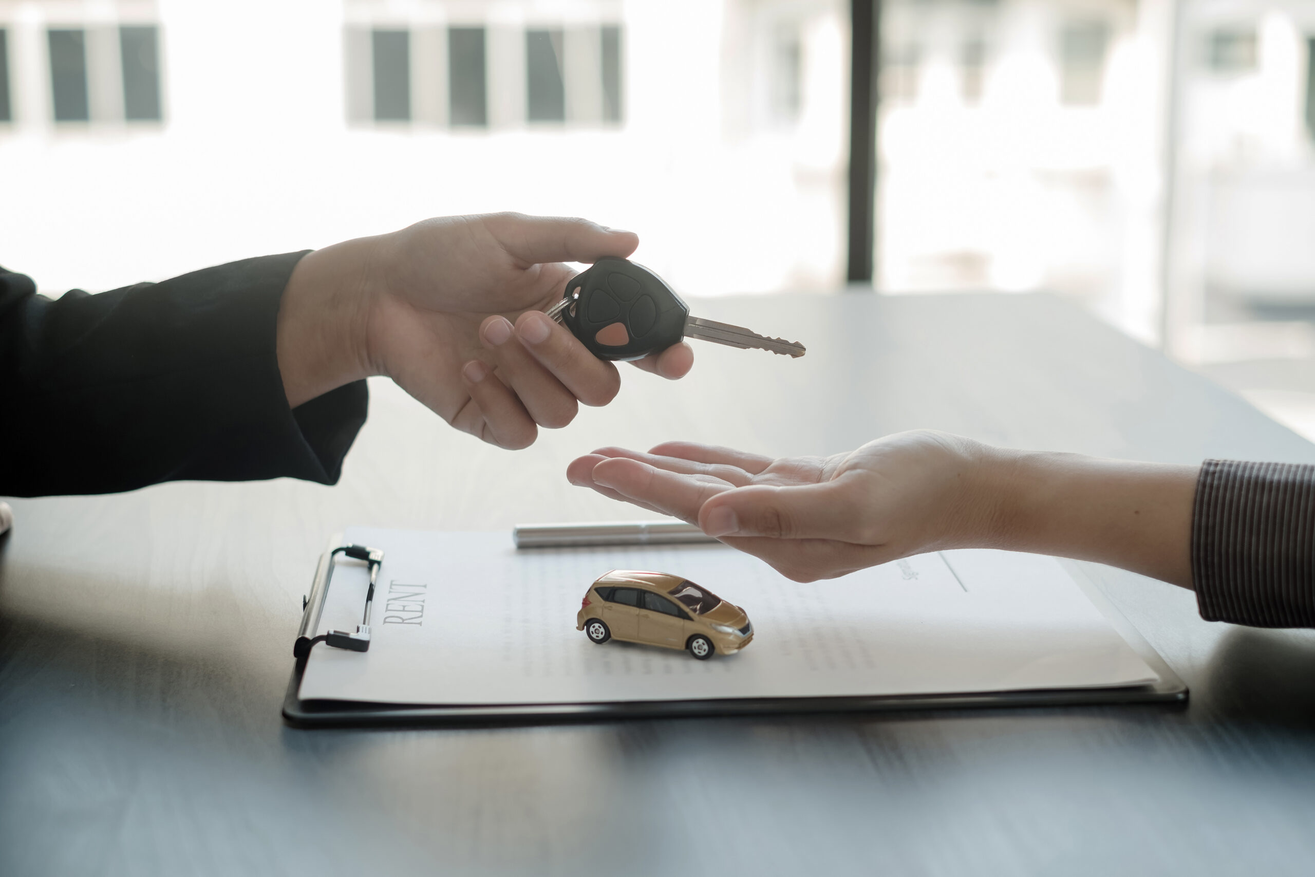 The car dealer provides advice on loans, insurance details, and The car dealer provides advice on loans, insurance details, and car rental information, and delivers the car with the keys after the rental contract is signed.